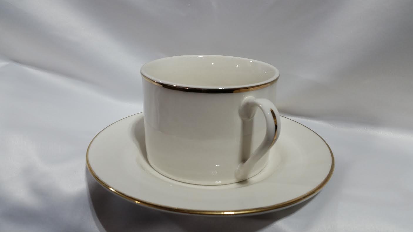 Gold rimmed coffee cup and saucer Platinum Event Rentals