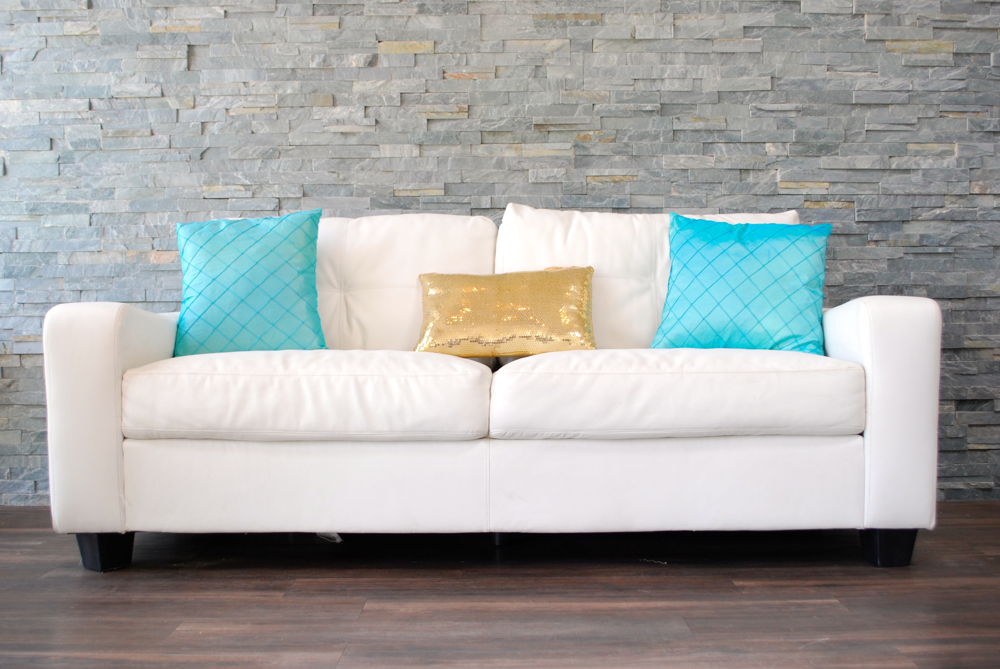 white sofa with colorful pillows